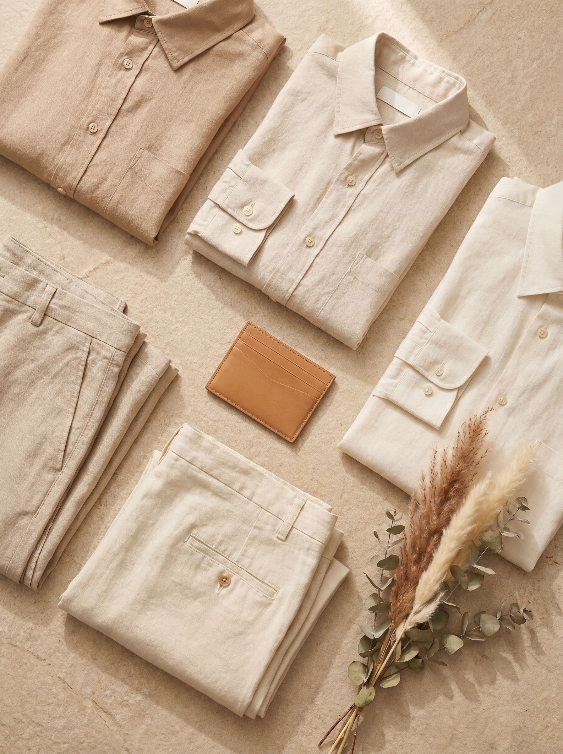 Folded linen garments flat lay